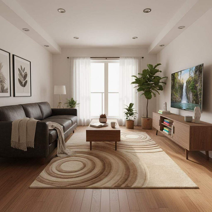 Translation missing: es.Minimalist cream and sand area rug with abstract circular carving placed on wooden flooring