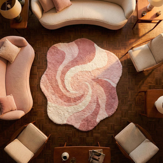 Translation missing: es.Pink abstract rug with irregular shape and wavy swirl pattern in plush shag material