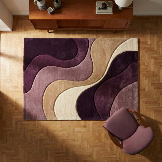 Translation missing: es.Modern abstract rug with plush texture and neutral wavy pattern in mauve, plum, beige, and cream tones