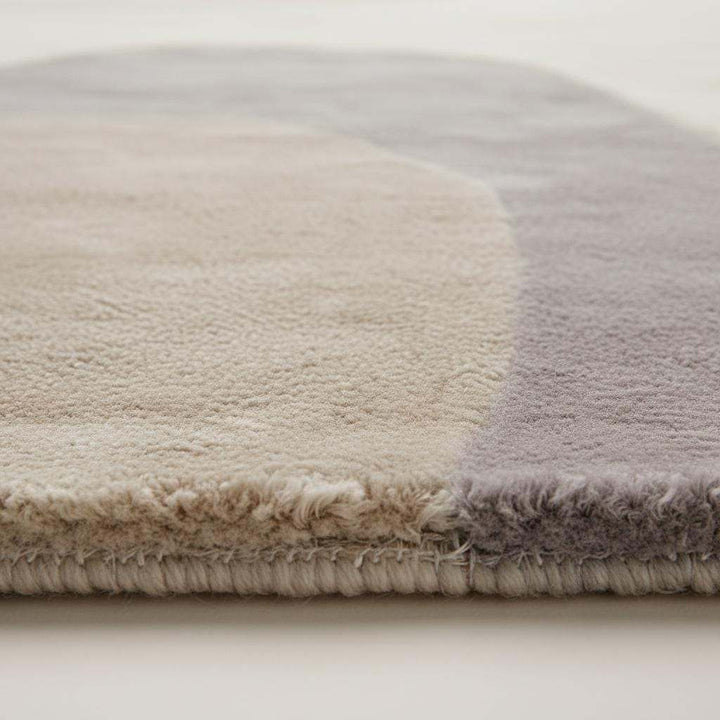 Translation missing: es.Neutral area rug with beige cream tones and organic shape for modern living rooms and nurseries