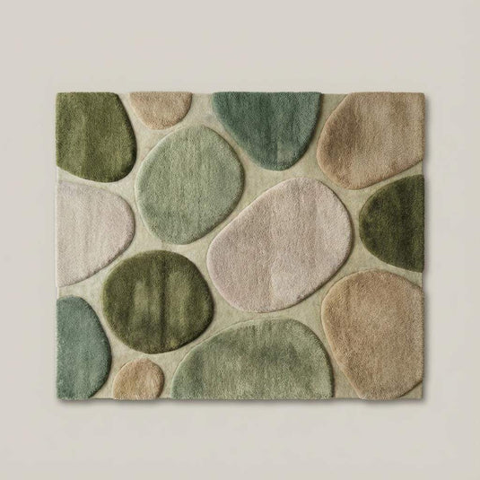 Translation missing: es.Top-down flat lay of organic modern area rug displaying abstract pebble pattern, curved shapes, and harmonious green and neutral color palette