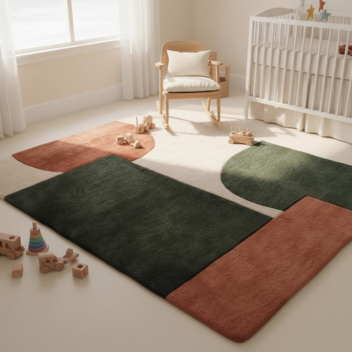 Translation missing: en.Soft tufted abstract rug with mid-century inspired shapes in terracotta and deep green beneath a neutral sofa