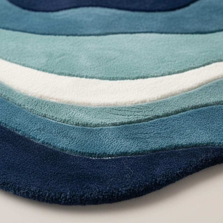 Translation missing: en.Modern wavy rug with abstract ocean blue pattern and plush textured pile