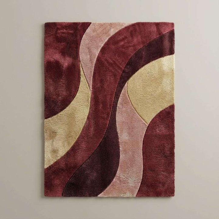 Translation missing: en.Plush geometric area rug with flowing curved shapes in warm red and neutral shades