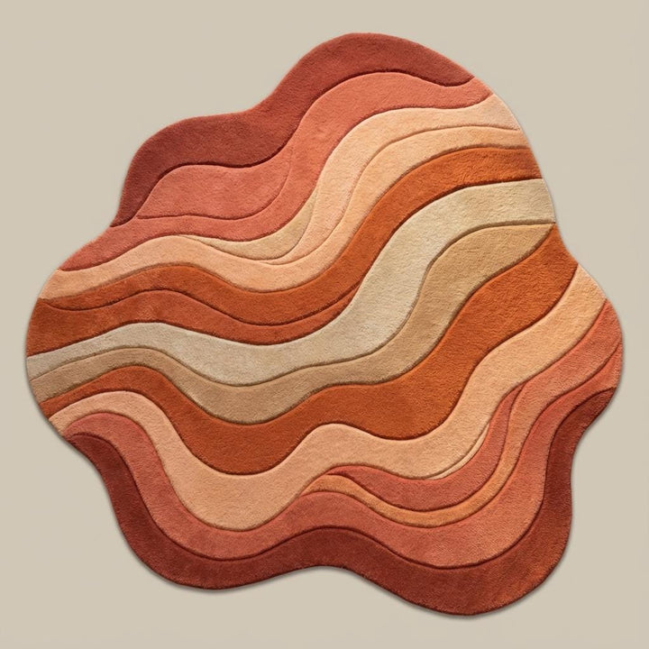 Translation missing: es.Organic-shaped boho rug with 70s-inspired flowing lines and warm colors on hardwood flooring surrounded by indoor plants