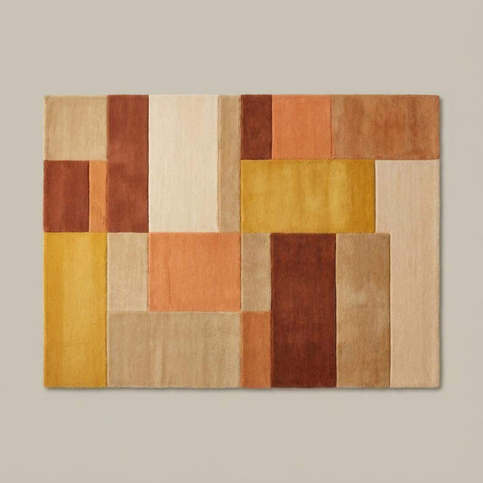 Translation missing: en.Color block rug in ochre, rust, and cream tones under a mustard accent chair in a modern boho living room setting