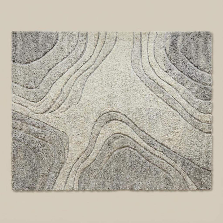 Translation missing: en.Scandinavian style abstract rug in cream and gray tones on hardwood floor