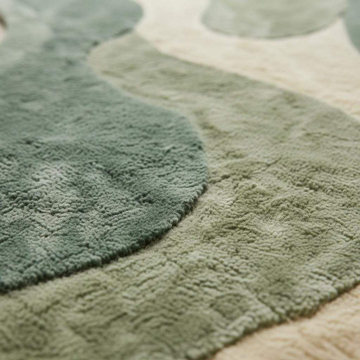 Translation missing: es.Sage green organic shape area rug with plush abstract design for modern living room and bedroom decor
