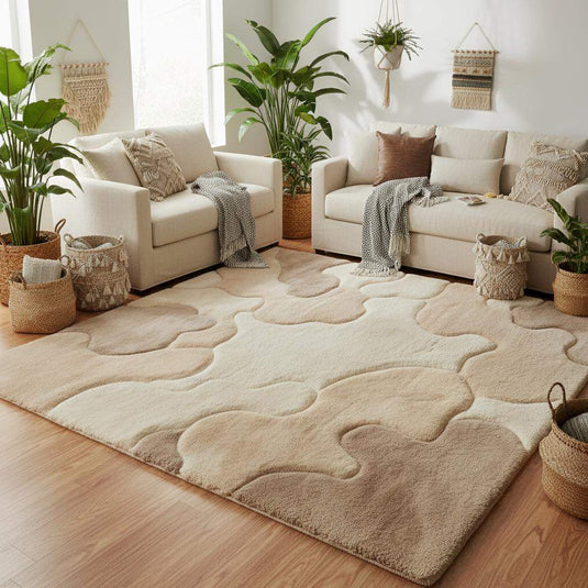 Translation missing: es.Plush beige abstract rug with cloud-like pattern placed in a modern living room with wood floors