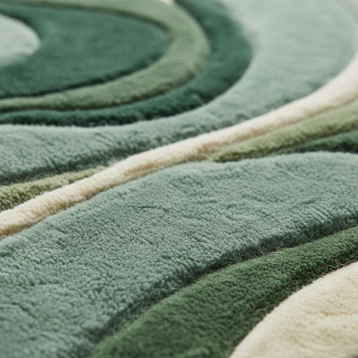 Translation missing: en.Modern green area rug with abstract sculpted wave design and plush tufted pile for minimalist decor