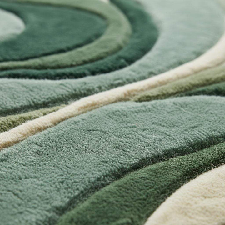 Translation missing: es.Abstract green area rug with sculpted organic wave pattern and plush texture