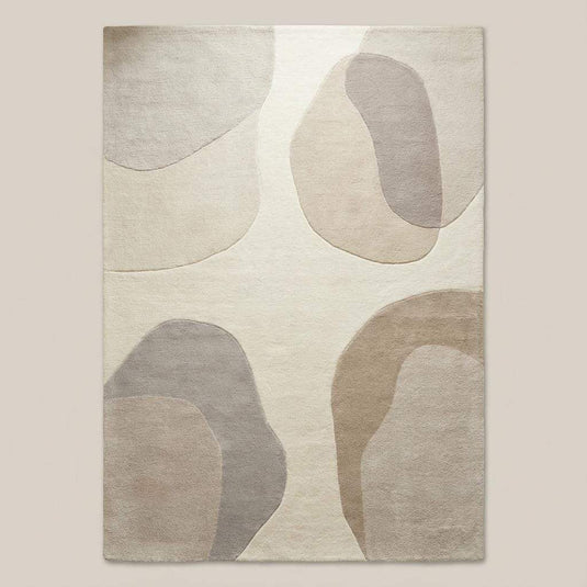Translation missing: es.Top-down view of abstract area rug displaying full organic shape pattern, neutral beige and cream color palette, and balanced modern design suitable for contemporary interiors