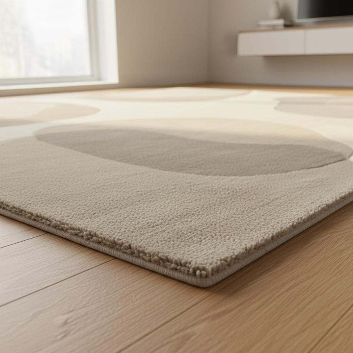 Translation missing: es.Abstract neutral area rug with organic shape in beige cream tones for modern living room decor