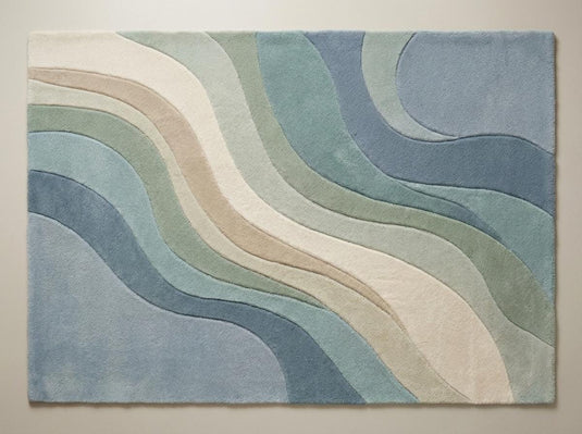 Translation missing: es.Top-down view of modern abstract wave pattern rug displaying full design, flowing curves, and blended pastel blue and green color palette